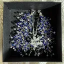 Tocado de plata y azul novia.webp